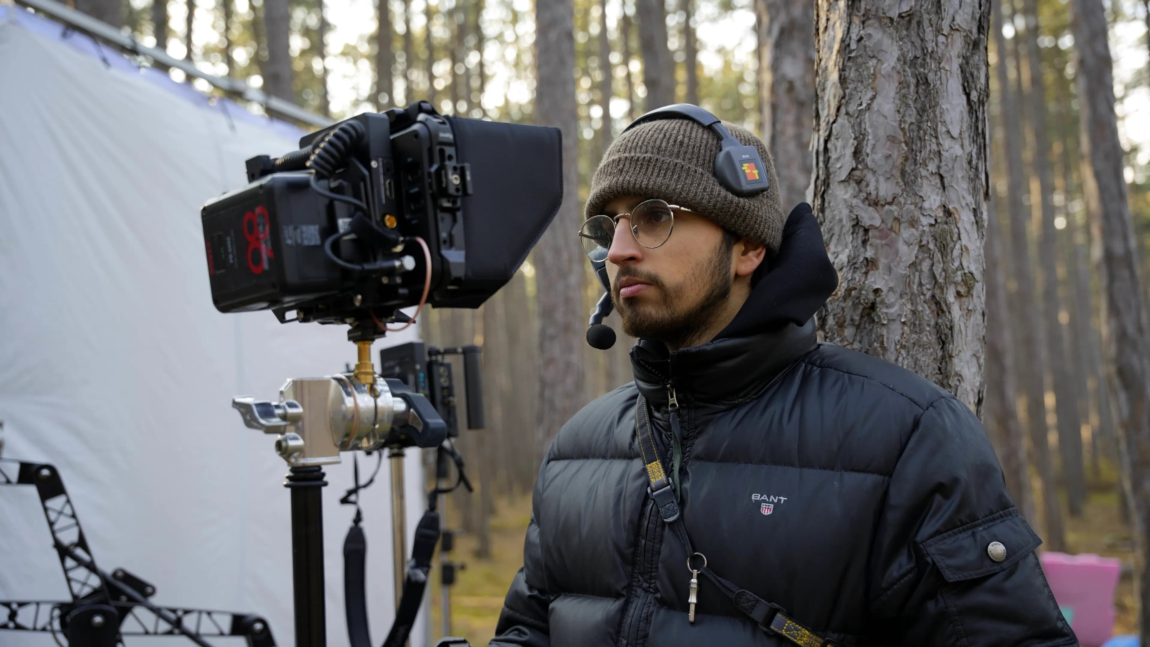 Willi Rose, Focus Puller and 1st AC, on set with cinema camera